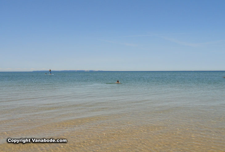 tiny man in big lake sleeping bear dunes np